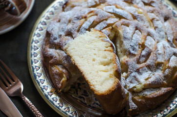 Pie with apples and almond petals