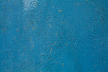 Blue stucco wall background with cracks