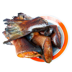 Obraz premium Smoked salmon meat on a plate. The object is isolated on a white background. Hot smoked fish close-up. Image for project and design