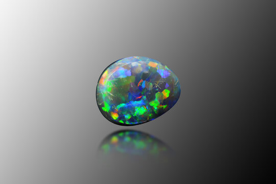 Natural australian precious black multi color play opal freeform cabochon polished gemstone setting for jewelry making. Coober Pedy mined, untreated, real gem. Yellow, blue, green, red, purple flashes