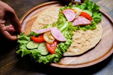 pita with vegetables and sausage.simple and delicious snack of flatbread