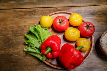 yellow and red tomatoes, lettuce and bell pepper with water drops. food blogger