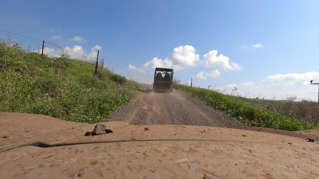 Driving nature road, landscape and scenic environment. Driver Point of view. Riding sports utility vehicle UTV side by side 4x4 4 wheel drive ATV.