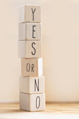 Yes versus no inscription on wooden cubes, balance,positivity,answers and question concept with...