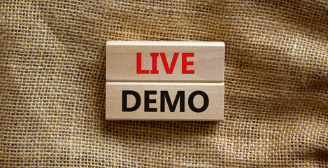 Live demo symbol. Concept words 'live demo' on wooden blocks on a beautiful canvas background. Copy...