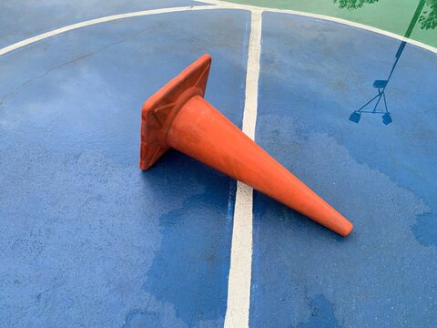 High Angle View Of Traffic Cone Fallen On Road