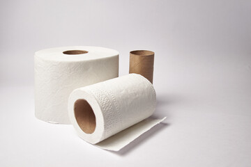Toilet paper rolls, household supply gradually running out with copy space and isolated on white backgorund
