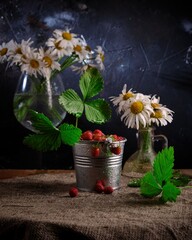 Bouquet from a camomile and wild strawberry