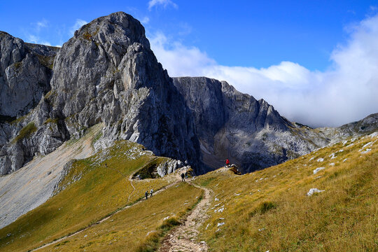 People go to Savin Kuk. Trekking in National Park Durmitor, Montenegro.