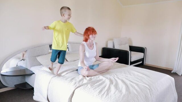 Relax on your bed. The child interferes with yoga. Mom is tired of homework. Day off.