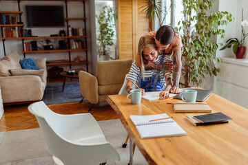 Lesbian couple working at home