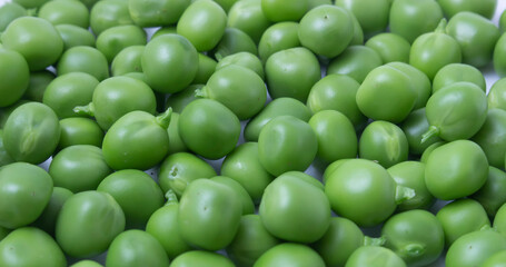 Background from green peas. Fresh young vegetables.