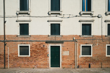 Fototapeta na wymiar Door and windows of a traditional Venetian houses in Venice, Italy