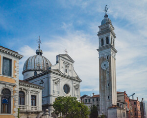 Tower and Church of San Giorgio dei Greci under blue sky in Venice, Italy