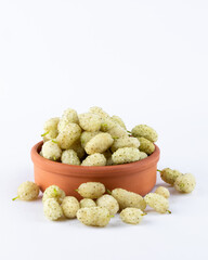 White mulberry with leaf closeup isolated on light background