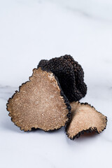 Giant and expensive rare cut black truffles close-up