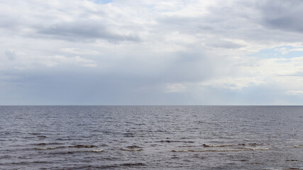 Fototapeta premium Cloudy weather above sea, lots of clouds