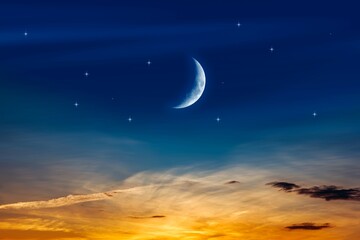 Fototapeta na wymiar Crescent moon with beautiful sunset background . bright sky