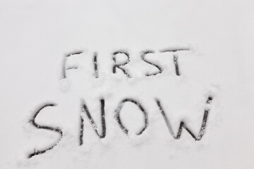 the inscription of the word snow on the white first snow