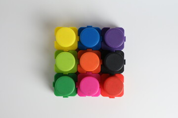 top view of color bucket jigsaws put together as a nine-piece square art 