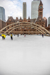 People skating at Nathan Phillips Square
