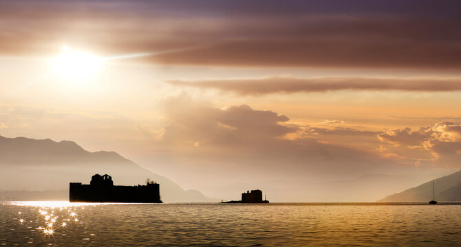 Italy, Piemonte, Lake Maggiore, Cannobio, Silhouette of Castle of Cannero on Lake Maggiore at sunset