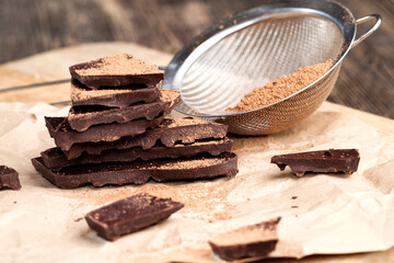 divided into pieces a piece of chocolate from cocoa