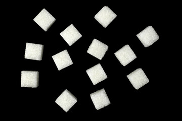 white sugar cubes on black background