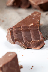 divided into pieces a piece of chocolate from cocoa