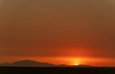 Solid Orange Sunset on Great Plains of Wyoming with Mountains