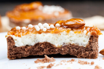 tartlet with milk cheese filling and lots of salted caramel with nuts