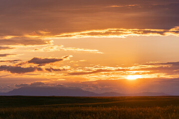 Sunset With Clouds on Great Plains of Wyoming with Mountains