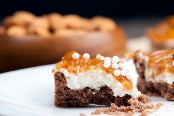 tartlet with milk cheese filling and lots of salted caramel with nuts