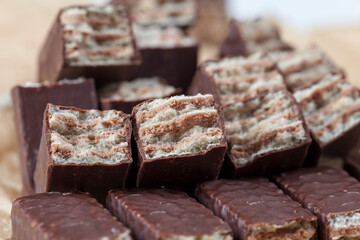 close-up of chocolate candies and crispy flour waffles