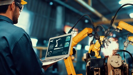 Smart industry robot arms modernization for innovative factory technology . Concept of automation manufacturing process of Industry 4.0 or 4th industrial revolution and IOT software control operation.