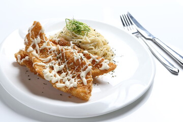 deep fried golden crispy fish fillet in tartar sauce with carbonara pasta noodle western seafood cuisine menu