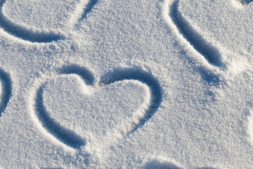 drawn in the winter season, the heart on the snow