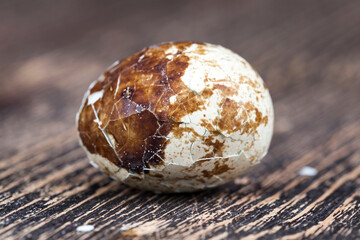 boiled quail egg on a wooden table