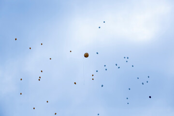 balloons with helium in sky