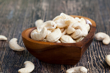 crunchy cashew nuts in a heart shaped bowl
