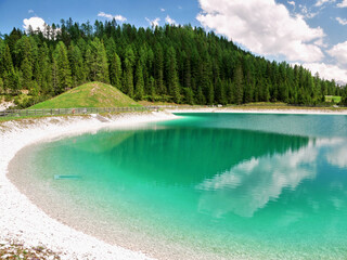 Turquoise lake with clear water in the Alps mountains