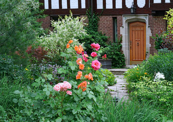 front yard of traditional house with rose bushes