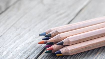 Obraz premium Close up of colored pencils on a wooden surface.