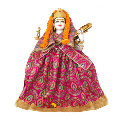 Saraswati goddess statue isolated on white background. Saraswati is the Hindu goddess of knowledge, music, art, wisdom, and learning.