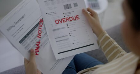 Upset tired young asia sad lady people sit sofa couch at home think hard worry in tax expense saving issue past due loan late payment on covid impact life feel grief pensive struggle in money lost.