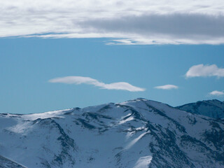 Fototapeta na wymiar Snow covered mountains in winter