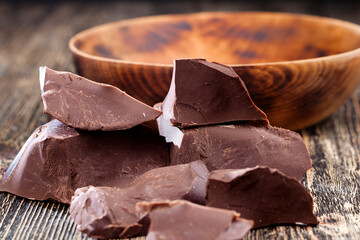 divided into pieces a piece of chocolate from cocoa