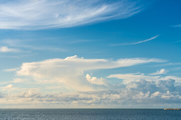 Golden cloudscape and blue sky in Indian ocean, Maldives island.