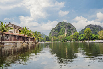 Fototapeta premium Trang An, Tam Coc, Ninh Binh, Viet nam. It's is UNESCO World Heritage Site, renowned for its boat cave tours. It's Halong Bay on land of Vietnam. Vietnam reopens borders after quarantine Coronovirus