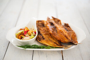 Deep fried Fish and green mango salad